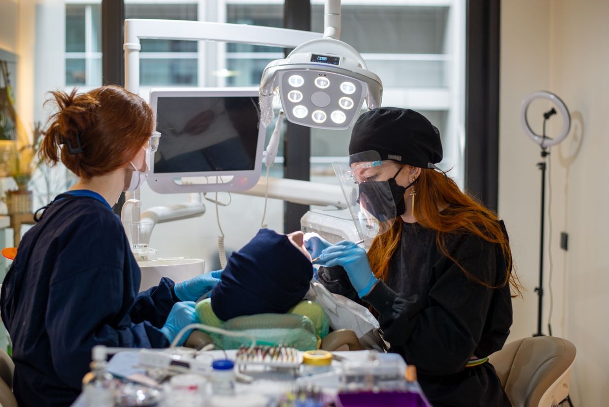 Dr. Hannah and her hygienist with a patient