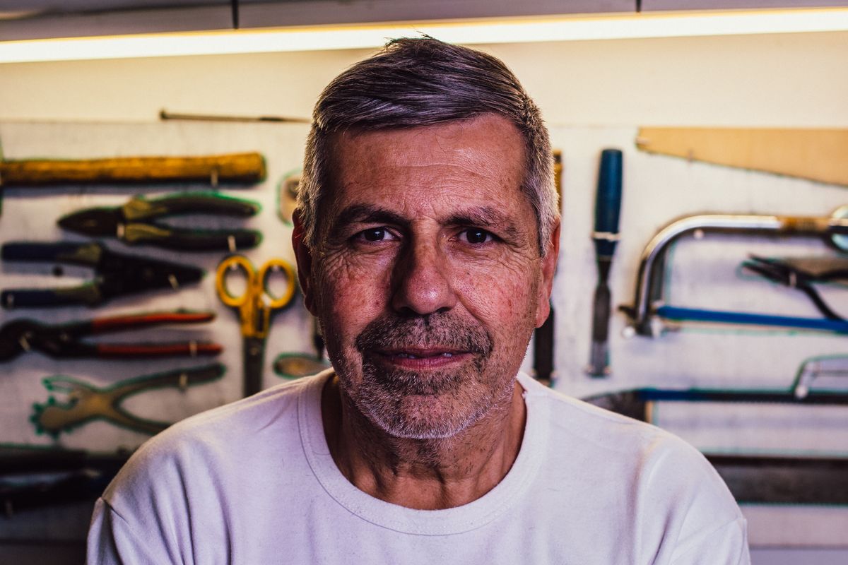 Jamal Brooks in front of his wall of hand tools